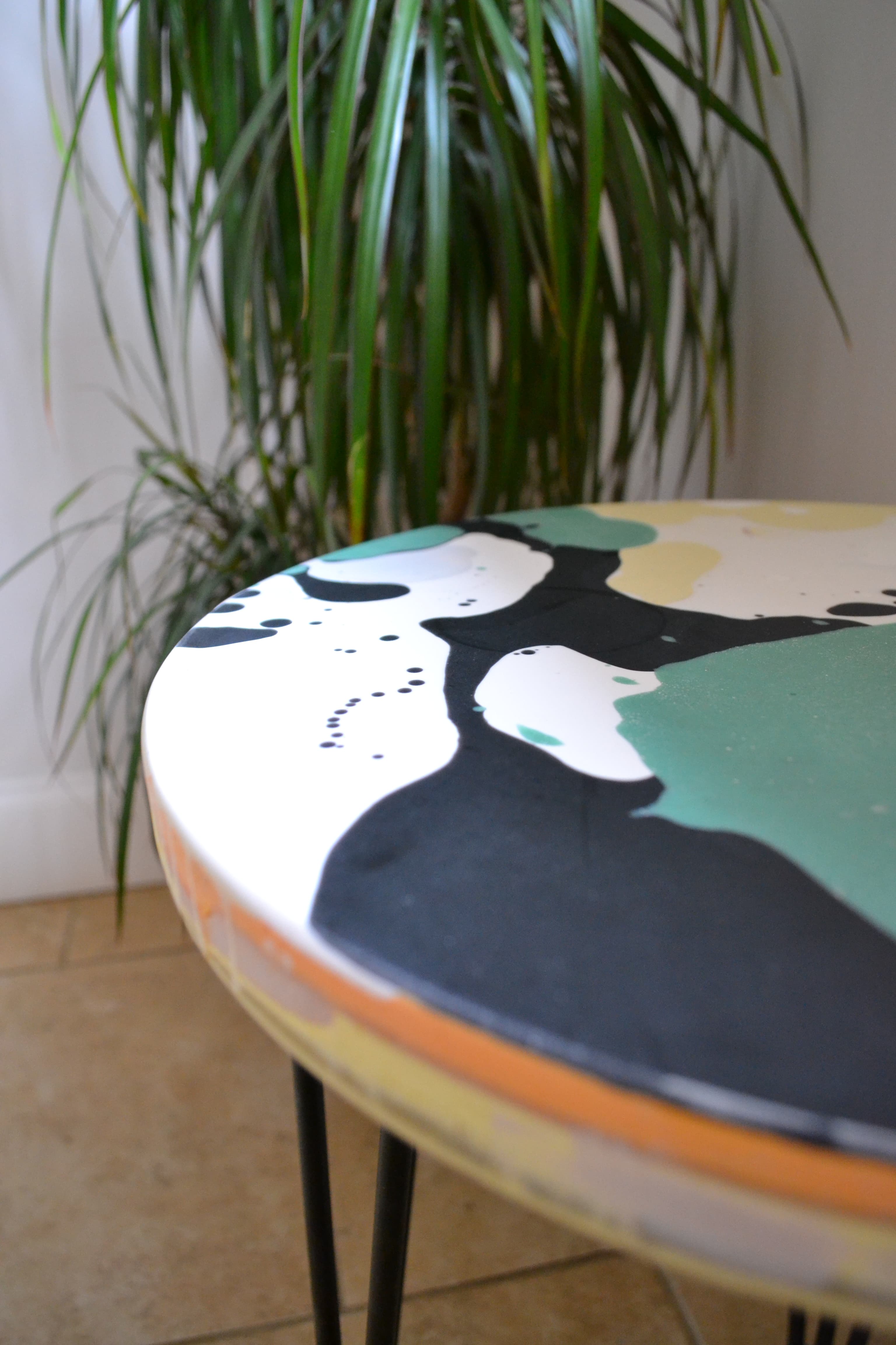 Close-up of resin and fibreglass texture on a green round table.