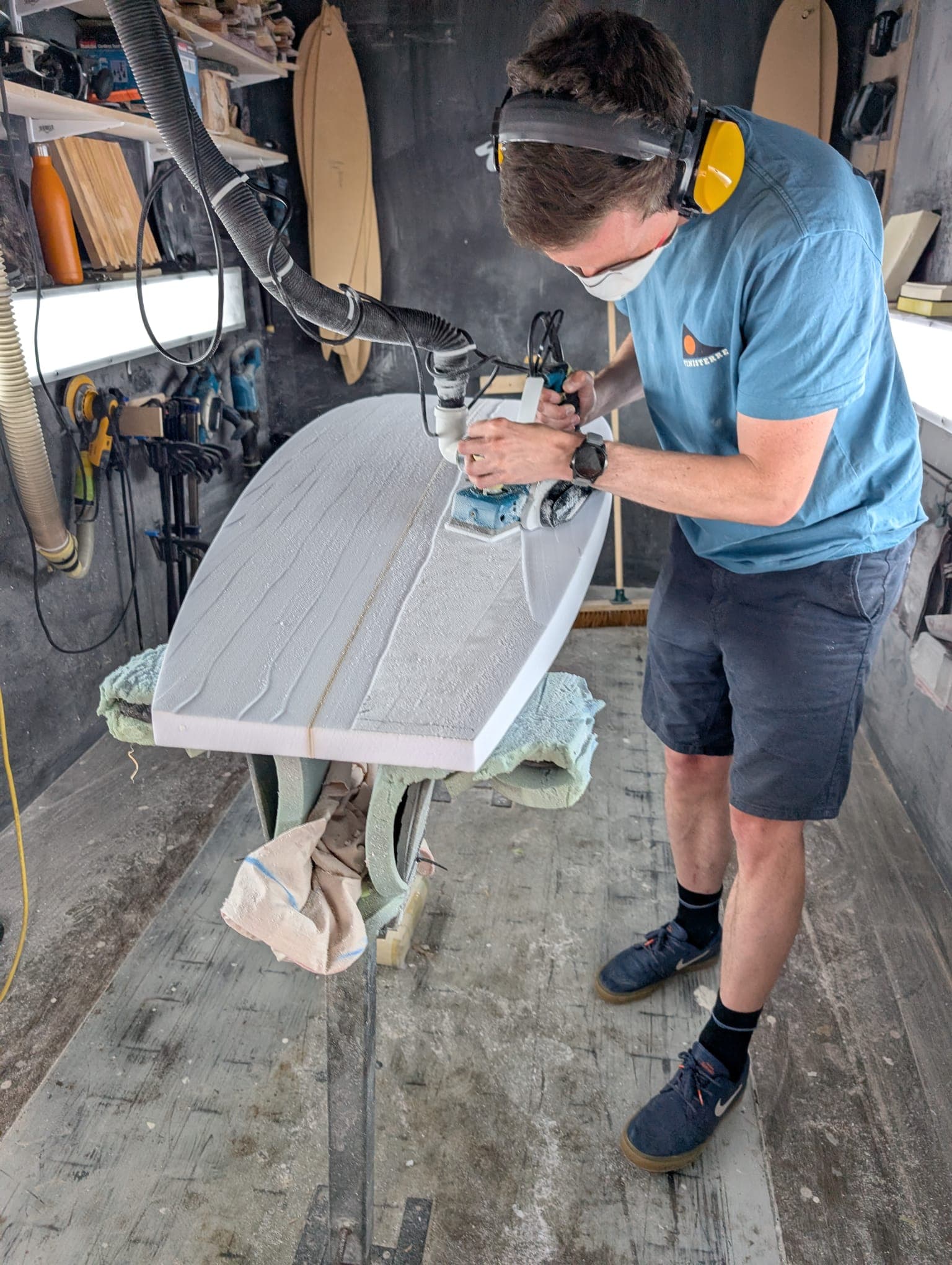 A board being shaped on the workshop stand.